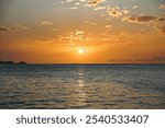 Sunset from a yacht in the Carribbean, orange sky