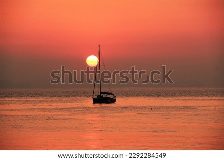 A sunset and the yacht. Cefal´u, Sicily, Italy