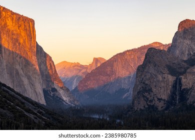 Sunset in Yosemite National Park, CA with view of the Half-Dome and El Capitan cliffs. - Powered by Shutterstock