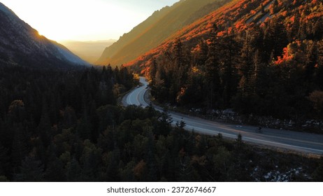 Sunsetting on winding road though a canyon