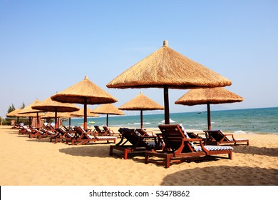 Sunshade And Chairs On Beach, Sanya, China