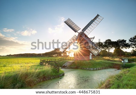 sunshine behind Dutch windmill, Groningen, Netherlands