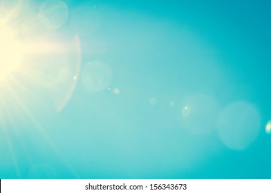 Sunshine and blue sky with flares in summer