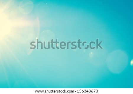 Sunshine and blue sky with flares in summer