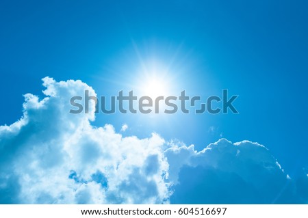 Sunshine and clouds with a blue, blue sky.