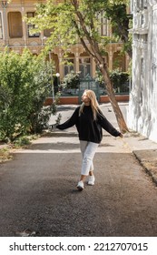 Sunshine Of Face Of Happy Blonde Woman In Trendy Outfit Walking On Street In Turkey