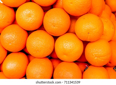 sunshine on many circle orange ripes lay one by one as background. texture of orange ripes