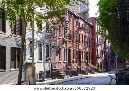 Sunshine on the trees, sidewalks, and historic buildings of Gay Street in the Greenwich Village neighborhood of Manhattan, New York City