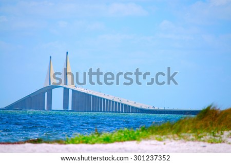 Sunshine Skyway Bridge crossing Tampa Bay in Florida with a beach in the foreground