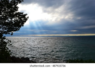Sunshine through a Cloud over Water