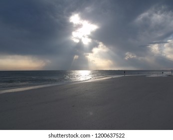 Sunshine through clouds.