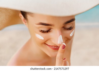 suntan lotion on nose