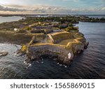 Suomenlinna is the island with  fortress outside Helsinki with the city in the background, Finland.