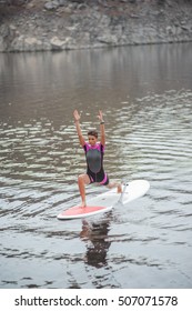 SUP Stand up paddle board woman paddleboarding