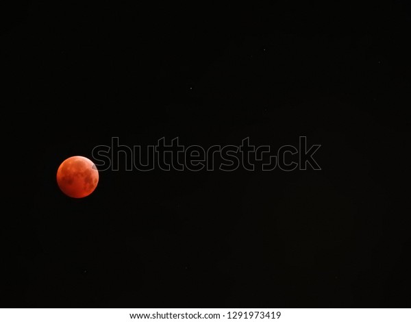 Super blood wolf moon eclipse: special lunar,\
beautiful black background and bright stars. Unique. 21 Januar\
2019. Part of a serie.