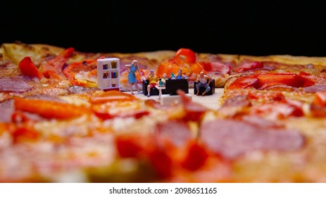 Super Bowl Day Party. Family Watching American Football Match And Eating Pizza, Conceptual Photo With Miniature Figurines. Snacks And Drinks For Watching A Football Game.