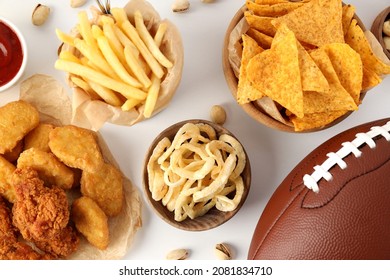 Super bowl and football snacks composition on white background. top view. nachos french fried and fried chicken. superbowl party celebration