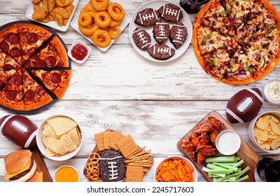 Super Bowl or football theme food frame. Pizza, hamburgers, wings, snacks and sides. Top down view on a white wood background. - Powered by Shutterstock