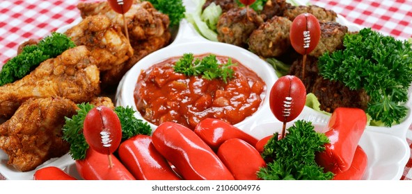 Super Bowl Sunday Football Party Celebration Food Platter With Chicken Buffalo Wings, Meat Balls, Hot Dogs On Red Check Table Cloth. Sized To Fit Popular Social Media And Web Banner Placeholder.