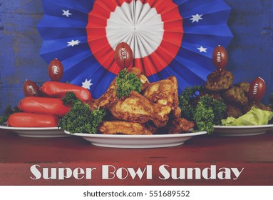 Super Bowl Sunday Football Party Celebration Food Plates With Chicken Buffalo Wings, Meat Balls, Hot Dogs And USA Party Decorations, With Text, With Applied Retro Style Filters.