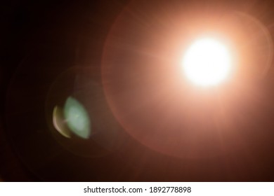 Super bright flashlight lens flare warm background, Sun effect