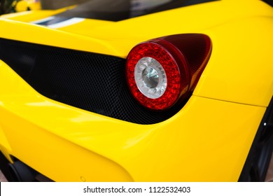 Super Car Is Loaded In Yellow Colors Parked In The Garage At House.