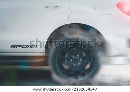 Super car wheel drifting and smoking on track