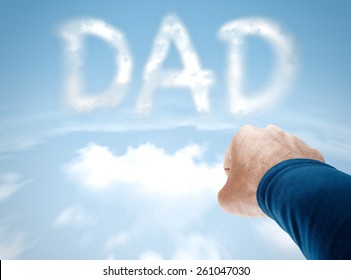 Super Dad Concept With Superman Arm Flying Towards Clouds Spelling DAD