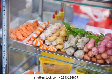 Super delicious street food, fried fish balls, street fast food. - Shutterstock ID 2233124879