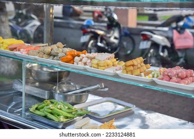 Super delicious street food, fried fish balls, street fast food. - Shutterstock ID 2233124881