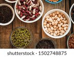 Super food. Raw cereals, grains, legumes, chickpeas, corn, quinoa, hemp, rice against rustic background top view. Vegetarians.