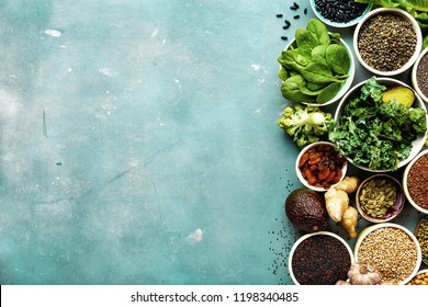 Super Food Or Vegetarian Food Concept. Seeds, Cereals, Beans, Vegetables, Herbs For Healthy Cooking On Blue Stone Background Top View With Copy Space