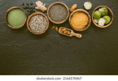 Super Foods On In Wooden Bowl. Selection Food And Healthy Food Set Up On Dark Stone Background.