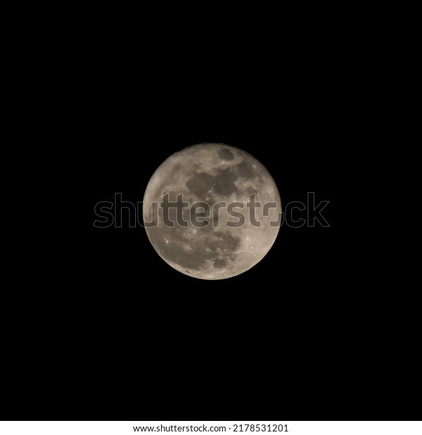 super full moon at clear\
night sky Depok, West Java, Indonesia, isolated picture, noisy at\
moon surface