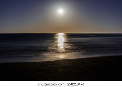 Super / Full Moon Setting / Rising On Moonstone Beach, Along The Big Sur Highway, On The California Central Coast, Near Cambria CA.