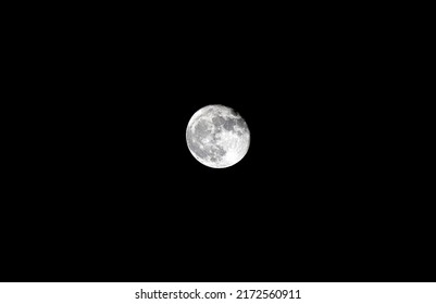 Super full strawberry moon with dark background. Landscape. Selective Focus