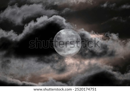 Super Harvest Moon behind clouds at Alligator Lake, Lake City, Florida