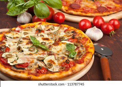  Super healthy vegetables and mushrooms pizza and salami pizza at the back