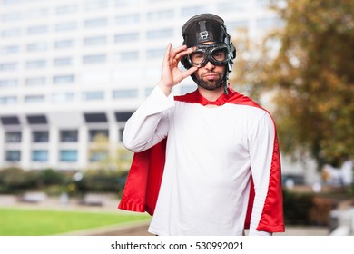 super hero holding his glasses