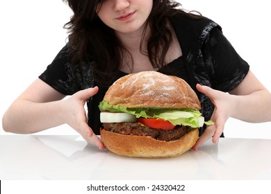 Super Huge Giant Burger And Teen Girl Trying To Eat It.