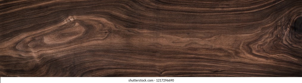 Super long walnut planks texture background.Dark tone walnut texture,Walnut natural texture, texture elements.