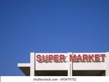 Super Market Sign On The Top Of The Edifice