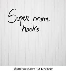 Super Mom Hacks Writing Love Text For Mother On Paper. Label Tag With Lovely Message For Mother`s Day.