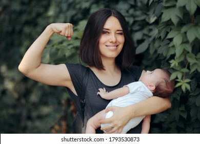 Super Mom In Strong Powerful Pose Holding Newborn. Super Heroine Mother Being A Role Mother To Her Daughter
