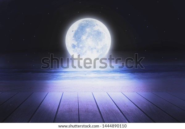 Super moon. a bright full moon and stars above the\
seascapes at night. Background to the tranquility of nature,\
outdoor at night.