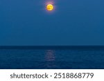 Super moon, also known as Harvest Moon, over the Lake Ontario, in Burlington, Ontario, Canada.