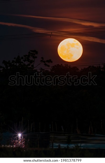 The super moon of May the 26 th\
2021 seen from the province of Pisa, Tuscany, Italy,\
Europe
