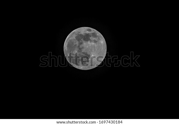Super moon on April 7th, 2020 very close above the\
North Sea island of Sylt