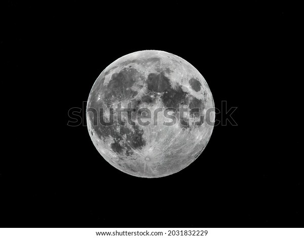 Super moon on black background. Full moon
background isolated on
black