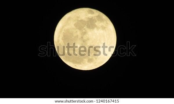 Super moon over dark black sky at night
taken. Full moon
background.